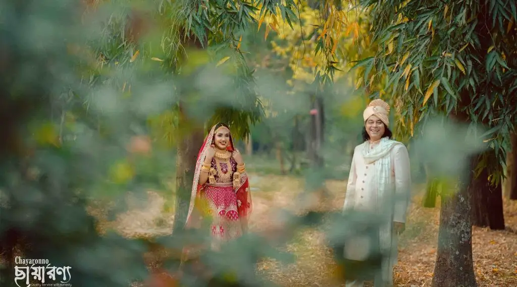 a woman in a red dress and a man in a white dress